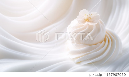 Creamy white cosmetic texture adorning delicate floral silhouette against flowing silk background, embodying refined skincare and beauty product elegance 127987030