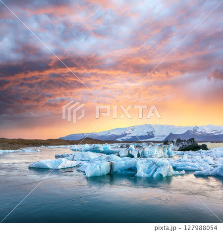 Ramarkable  landscape with floating icebergs in Jokulsarlon glacier lagoon at sunset. 127988054