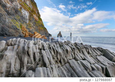 Impressive landscape with basalt rock formations Troll Toes on Black beach Reynisfjara near the village of Vik. 127988087