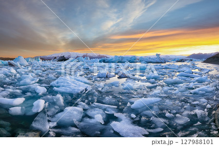 Ramarkable  landscape with floating icebergs in Jokulsarlon glacier lagoon at sunset. 127988101