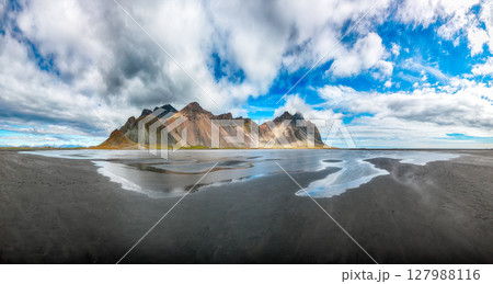 Impressive  sunny day and gorgeous reflection of Vestrahorn mountaine on Stokksnes cape in Iceland. 127988116