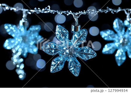 Glowing blue snowflake lights festive winter holiday decorations 127994934