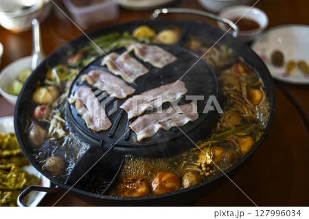 Mookata BBQ Thai Style, Grilled Bacon And Cook Vegetables In The Soup, Background for advertising and wallpaper in culture and food scene. Mookata BBQ Thai Style, Grilled Bacon And Cook Vegetables In The Soup, Background for advertising and wallpaper in culture and food scene. 127996034