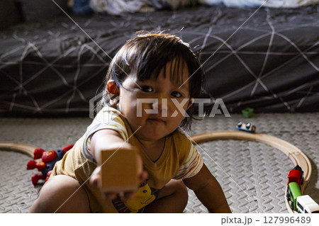 Toddler Playing With Wooden Toys, Background for advertising and wallpaper in education and lifestyle scene. 127996489