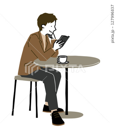 カフェでコーヒーを飲みながら読書をする男性3 127996837