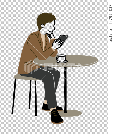 カフェでコーヒーを飲みながら読書をする男性3 127996837