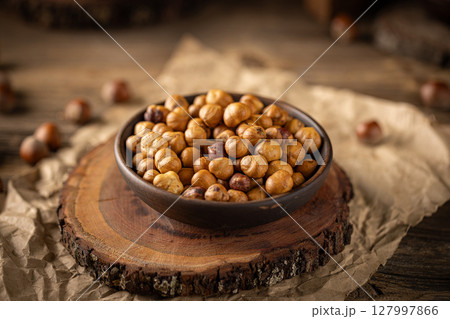Close up of roasted hazelnuts 127997866