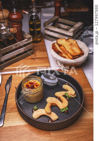 Chicken liver pate served with caramelized quince Chicken liver pate served with caramelized quince 127997880
