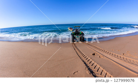 Tractor Assist Boat Entry Beach Ocean  127999076