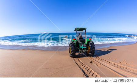 Tractor Assist Boat Entry Beach Ocean Tractor Assist Boat Entry Beach Ocean 127999077