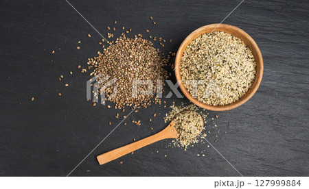 Shelled hemp seeds pile, peeled cannabis grains, marijuana kernels without peel Shelled hemp seeds pile, peeled cannabis grains, marijuana kernels without peel 127999884