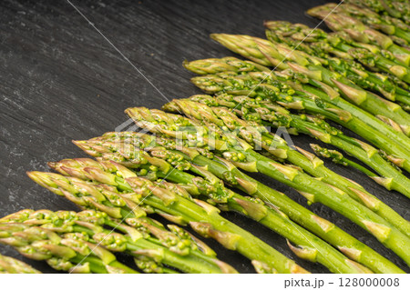Bunch of Raw Garden Asparagus Textured Background. Fresh Green Spring Vegetables Bunch of Raw Garden Asparagus Textured Background. Fresh Green Spring Vegetables 128000008