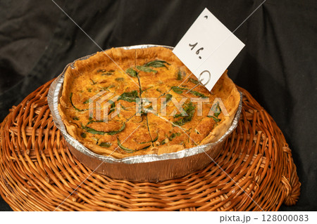 Round pie with herbs and vegetables Round pie with herbs and vegetables 128000083
