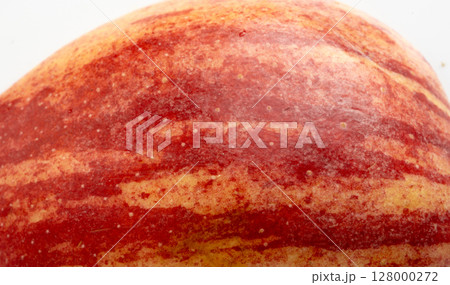 Red apple skin macro texture. Honeycrisp fruit surface close up, fresh spotted and striped apple 128000272