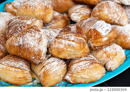 Many sfogliatella cakes on street market. Sfogliatelle puff pastry, naples bakery 128000304