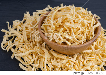 Passatelli spatzle pasta in bowl, raw spaetzle noodles, dry homemade german macaroni Passatelli spatzle pasta in bowl, raw spaetzle noodles, dry homemade german macaroni 128000392