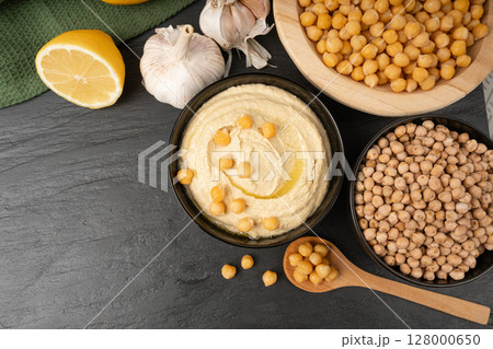 Hummus in bowl, houmous dip, chickpea humus tahini sauce, middle eastern spread 128000650