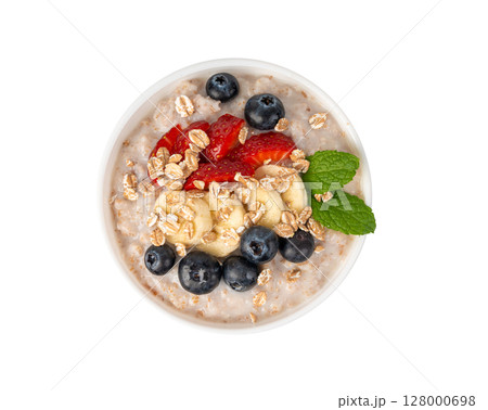 Cooked spelt in bowl isolated. Oatmeal milk porridge with fruits and berries Cooked spelt in bowl isolated. Oatmeal milk porridge with fruits and berries 128000698