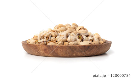 Fried salt pistachio nuts isolated. Baked pistachios pile, roasted green pistache fruit in shell on white 128000784