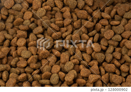 Dry pet food, dog kibble pile, puppy pellets, small canine protein croquette meal, animal food Dry pet food, dog kibble pile, puppy pellets, small canine protein croquette meal, animal food 128000902