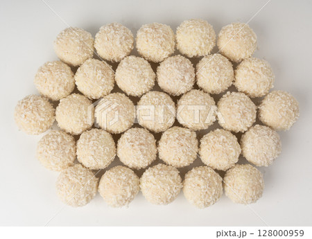 Coconut candies isolated, coco balls set. White truffle ball, indian ladoo or laddu with sweet cream 128000959