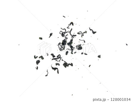Wakame seaweed pieces isolated, edible raw algae, dry undaria pinnatifida healthy food kelp Wakame seaweed pieces isolated, edible raw algae, dry undaria pinnatifida healthy food kelp 128001034