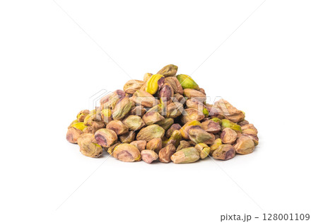 Fried salt pistachio nuts isolated. Baked pistachios pile, roasted green pistache fruits on white Fried salt pistachio nuts isolated. Baked pistachios pile, roasted green pistache fruits on white 128001109
