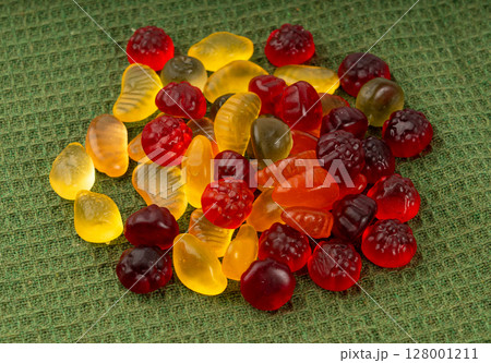 Fruit gummy candy pile, vegan chewing marmalade pills, jelly gumdrops heap Fruit gummy candy pile, vegan chewing marmalade pills, jelly gumdrops heap 128001211