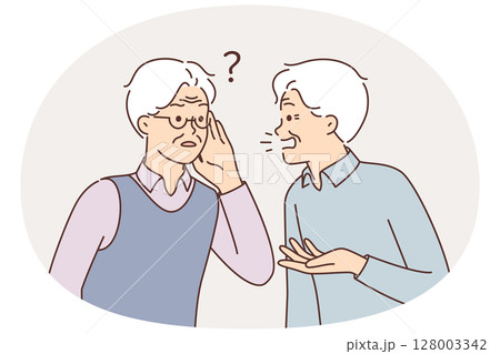 An old man is talking to a deaf friend who is having problems after his hearing aid broke 128003342