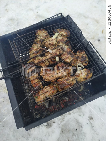 T-Bone Steak on Barbecue Grill Flames 128003416