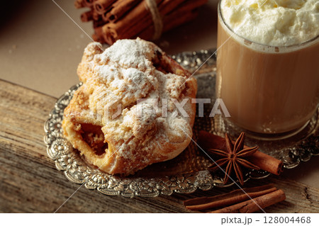 Vienna strudel and caffe latte on a silver tray. Vienna strudel and caffe latte on a silver tray. 128004468