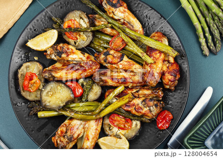 Freshly baked chicken wings. 128004654