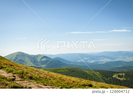 landscape, peaks of mountain hills against the background of the morning sky 128004712