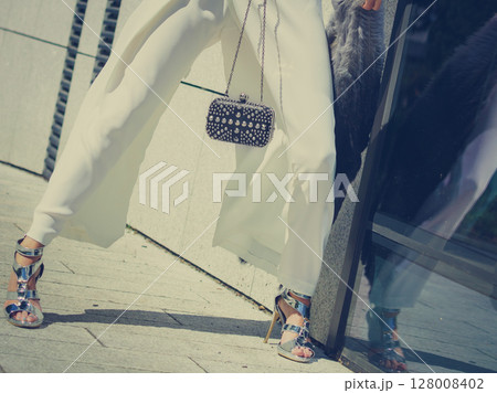 Woman wearing high heels and culottes Woman wearing high heels and culottes 128008402