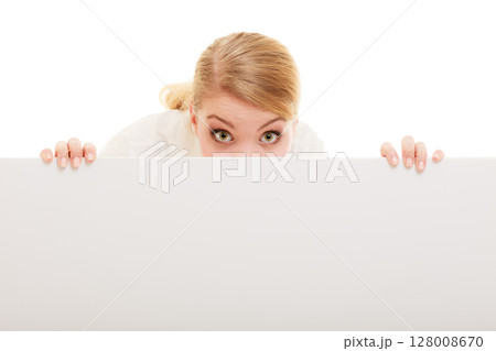 Businesswoman hiding behind blank copy space banner Businesswoman hiding behind blank copy space banner 128008670