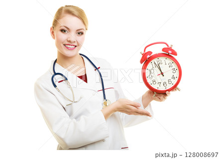 Woman doctor with clock isolated on white Woman doctor with clock isolated on white 128008697