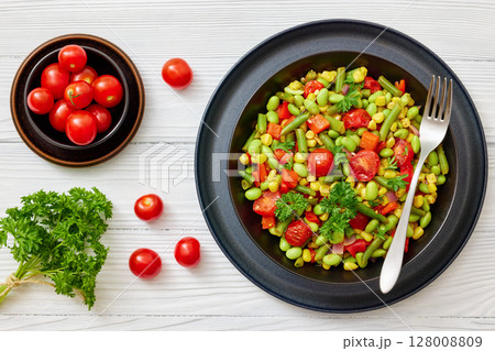 succotash of corn, beans, tomatoes, in black bowl 128008809