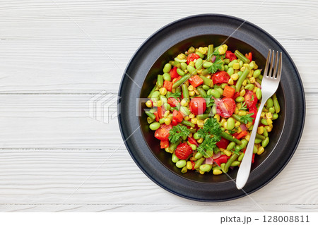 succotash of corn, beans, tomatoes, in black bowl 128008811