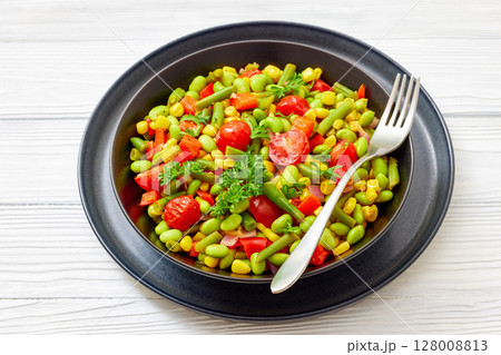succotash of corn, beans, tomatoes, in black bowl 128008813