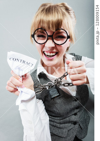 Furious woman with chained hands and contract Furious woman with chained hands and contract 128009154