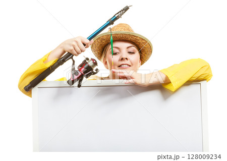 Happy woman with fishing rod holding board 128009234