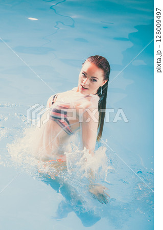 Sexy seductive woman in water. 128009497