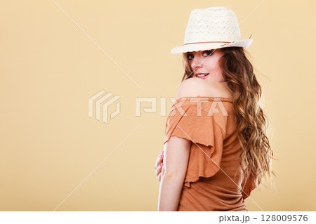 Lovely girl in summer clothes bright straw hat Lovely girl in summer clothes bright straw hat 128009576