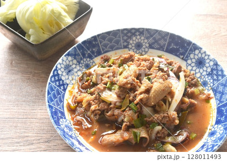 Thai spicy and sour chop duck meat salad and fresh cabbage on plate  128011493