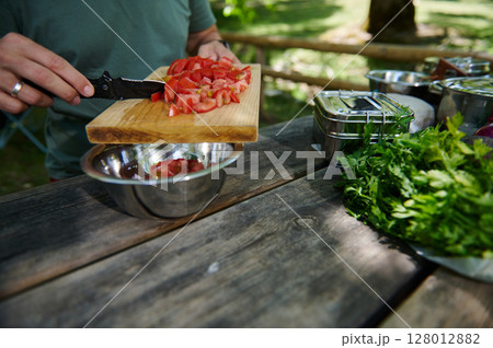 Outdoor Cooking Using Fresh Ingredients While Chopping Vegetables Outdoor Cooking Using Fresh Ingredients While Chopping Vegetables 128012882