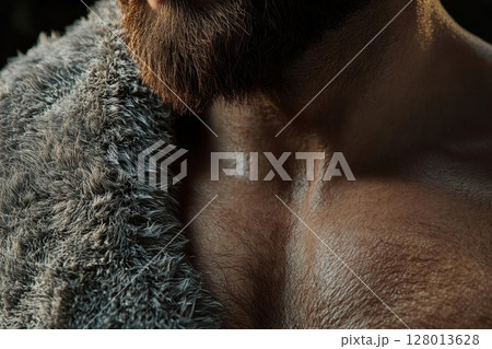 Close-up of a Man's Chest and Beard with a Furry Garment 128013628