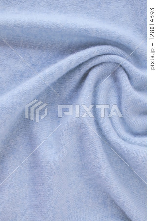 Blue cashmere fabric, textile is folded, knitwear texture, natural fabric, top view Blue cashmere fabric, textile is folded, knitwear texture, natural fabric, top view 128014393