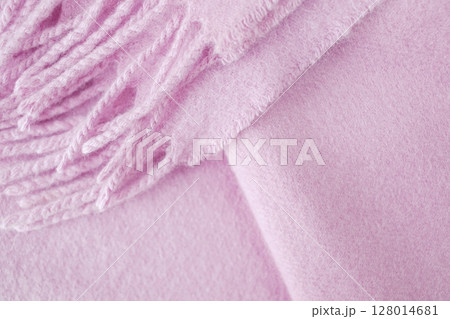 Cashmere pink stole. Texture, background, drapery. Fabric made of natural wool and silk, pastel pink color. 128014681