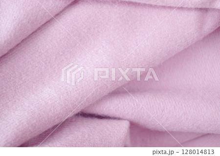Cashmere pink stole. Texture, background, drapery. Fabric made of natural wool and silk, pastel pink color. 128014813