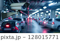 Security camera monitoring heavy traffic on a busy city street during rush hour. 128015771